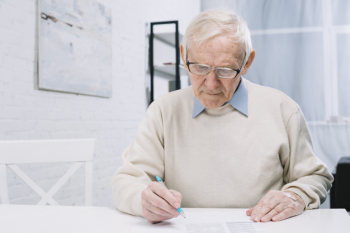 Senior man doing paperwork Senior man doing paperwork