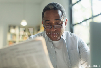 Senior man reading newspaper Senior man reading newspaper