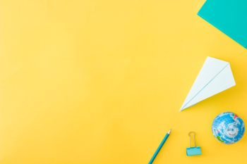 Set of accessories laying on yellow background