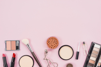 Set of makeup and cosmetic beauty products on pink background Free Photo