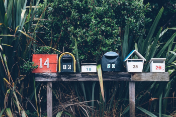 Several mailboxes on a post | Free Photo - rawpixel