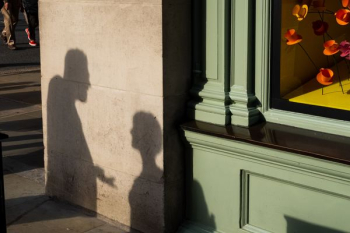 shadows of people reflecting on wall shadows of people reflecting on wall