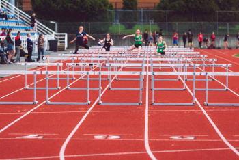 Shallow Focus Photo of People Playing Track and Field Shallow Focus Photo of People Playing Track and Field