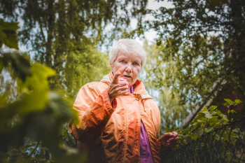 Shallow Focus Photo of Woman Near Plants Shallow Focus Photo of Woman Near Plants