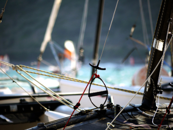 Shallow Focus Photography of Black Boat Shallow Focus Photography of Black Boat