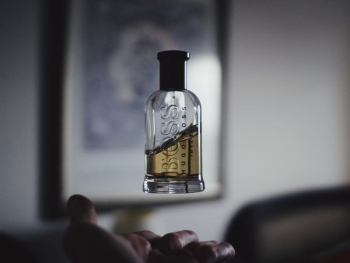 shallow focus photography of floating perfume bottle shallow focus photography of floating perfume bottle