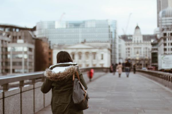 shallow focus photography of woman in green coat shallow focus photography of woman in green coat