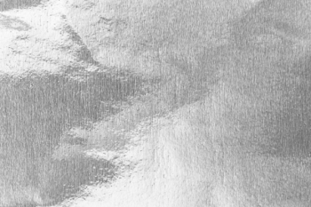 Shiny silver gray foil texture for background.