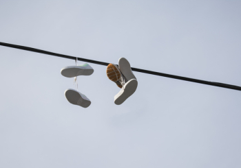 Shoes Hanged on Black Pole Shoes Hanged on Black Pole