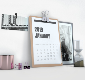 Sideways calendar mockup on workspace Free Psd