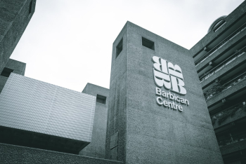 Signage at the elevated entrance to the Barbican Centre.