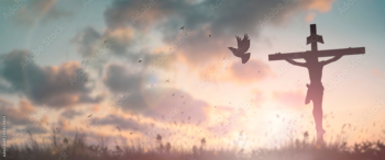 Silhouette jesus christ crucifix on cross on calvary sunset background concept for good friday he is risen in easter day, good friday worship in God, Christian praying in holy spirit religious.