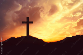 Silhouette of crosses symbol on the mountain peak with dramatic cloud on the sky at sunrise