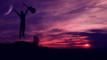 Silhouette of Man Holding a Guitar Silhouette of Man Holding a Guitar