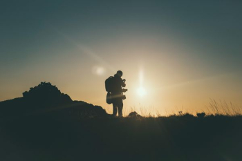 silhouette of mountain climber at golden hour silhouette of mountain climber at golden hour