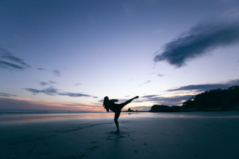 silhouette of person kicking on mid air silhouette of person kicking on mid air
