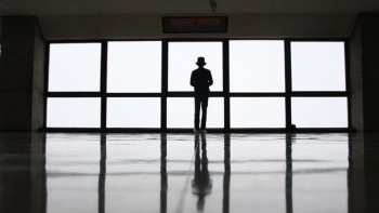 silhouette of person near window silhouette of person near window
