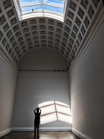 Silhouette Of Person Standing Inside Empty Room