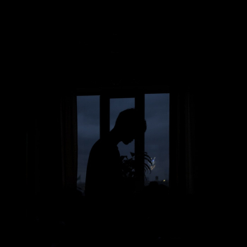 Silhouette of Person Standing Near Window Silhouette of Person Standing Near Window