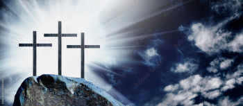 Silhouette of three crosses on a rocky hill against dramatic sky background and symbolize the Crucifixion of Christ.