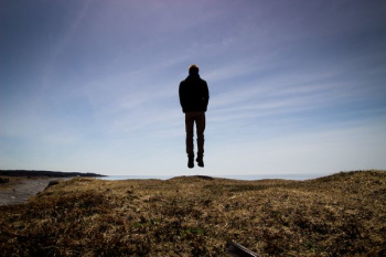 silhouette on floating man silhouette on floating man