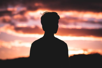 silhouette photography of man standing in front of red sky silhouette photography of man standing in front of red sky