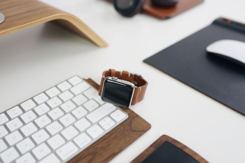 silver aluminum case Apple Watch on Apple Magic keyboard silver aluminum case Apple Watch on Apple Magic keyboard