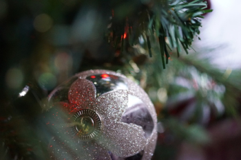 Silver Christmas Bauble Hanging on Christmas Tree Silver Christmas Bauble Hanging on Christmas Tree