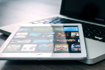 silver iPad on top of MacBook Pro silver iPad on top of MacBook Pro