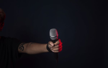 Singer On Stage Holds Mic Singer On Stage Holds Mic