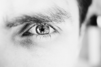 Single male eye in black and white Single male eye in black and white