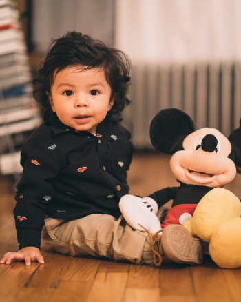 Sitting Child Playing Mickey Mouse Plush Toy Sitting Child Playing Mickey Mouse Plush Toy