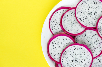 Sliced Dragon Fruit on White Plate Sliced Dragon Fruit on White Plate