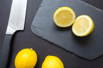 Sliced Lemons on Black Surface Sliced Lemons on Black Surface