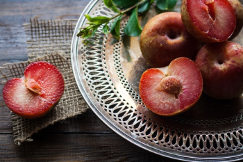 Sliced Plums on Silver Round Platter Sliced Plums on Silver Round Platter