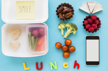 Smartphone near lunch food Smartphone near lunch food