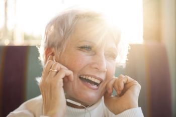 Smiley senior female listening music Free Photo