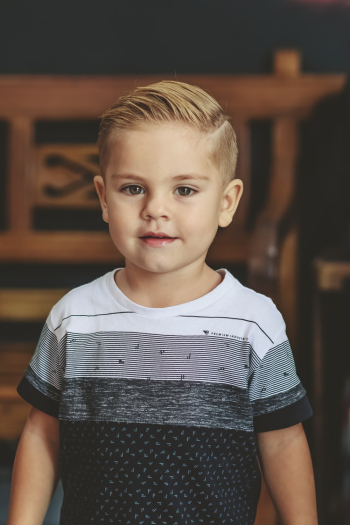 Smiling Boy Wearing White And Black Crew Neck T-shirt Smiling Boy Wearing White And Black Crew Neck T-shirt