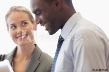 Smiling business people talking in meeting Smiling business people talking in meeting