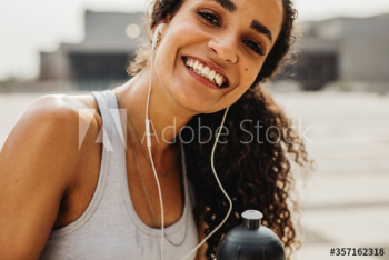Smiling fitness woman outdoors Smiling fitness woman outdoors