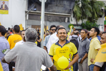 Smiling Man Standing Near Group of People Smiling Man Standing Near Group of People
