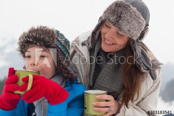 Smiling mother and son drinking hot cocoa Smiling mother and son drinking hot cocoa