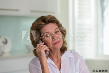 Smiling senior woman talking on telephone Smiling senior woman talking on telephone