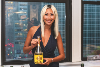 Smiling Woman Holding Wine Smiling Woman Holding Wine