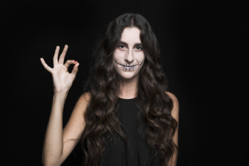Smiling woman showing ok sign Smiling woman showing ok sign