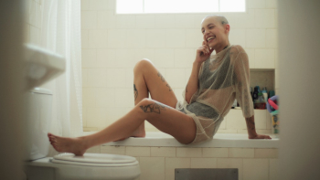Smiling Woman Sitting On Bath Tub Smiling Woman Sitting On Bath Tub
