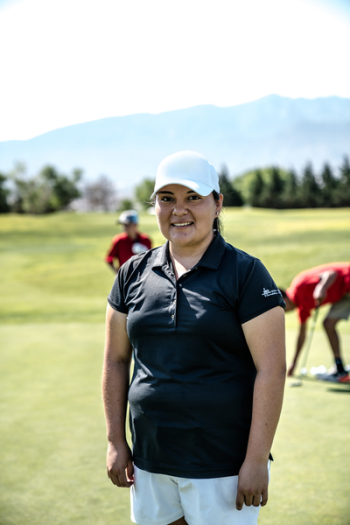 Smiling Woman Standing on Golf Course Smiling Woman Standing on Golf Course