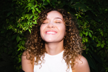 Smiling Woman With Curly Hair Smiling Woman With Curly Hair