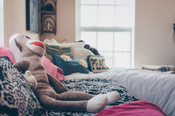Sock Monkey Plush Toy On Bed Sock Monkey Plush Toy On Bed