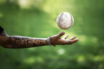 Softball Flies Above Hand Softball Flies Above Hand